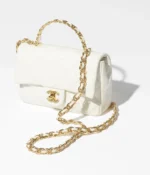 SMALL FLAP BAG WITH TOP HANDLE. - Image 2