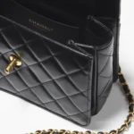 SMALL FLAP BAG WITH TOP HANDLE.